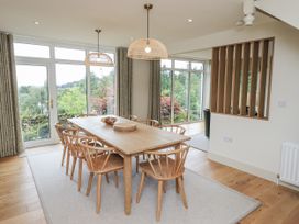 A dining room with a table and chairs at Rowanhill in Kendal