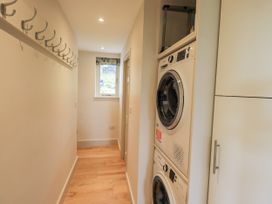 A laundry room with washing machine and tumble dryer at Rowanhill Kendal