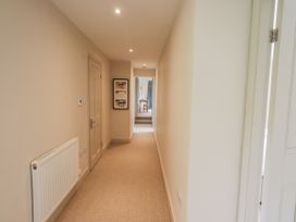 A hallway with door and radiator at Rowanhill in Kendal