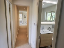 A bathroom with a vanity and sink in a hallway at Rowanhill Kendal