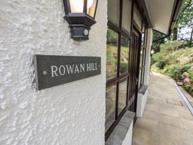 A sign labeled Rowan Hill on the outdoor wall at Rowanhill in Kendal