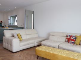 A living room with sofas and a coffee table at Seacroft in Torquay