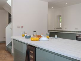 A kitchen with an island and food items at Seacroft in Torquay