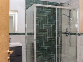 A bathroom with a shower and sink at Seacroft in Torquay
