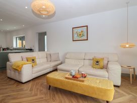 A living room with a sofa and coffee table at Seacroft in Wellswood near Torquay