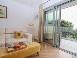A living room with a sofa and coffee table at Seacroft in Wellswood near Torquay