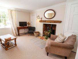 A living room with furniture and a television at Beehive in Beccles