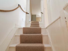 Stairs leading up with a rope handrail at Beehive in Beccles