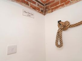 A rope on the wall and a sign at Beehive in Beccles