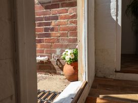 A doorway with a potted plant outside at Beehive in Beccles