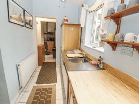 A kitchen with a sink and countertop at 2 Bens Row Backbarrow near Newby Bridge