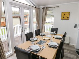 A dining room with a table set at Erisa 