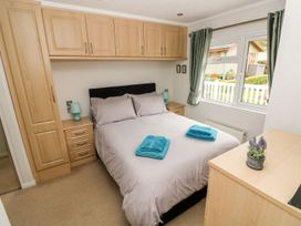 A bedroom with a bed and wardrobe at Erisa