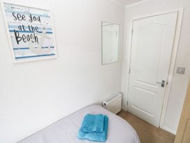 A bedroom with a towel on the bed at Erisa