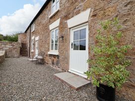 A door with steps and gravel at Isfryn in 