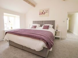 A bedroom with a bed and window at Isfryn