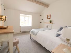 A bedroom with a bed and window at Isfryn