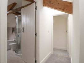 A bathroom with a shower and bathtub at Isfryn