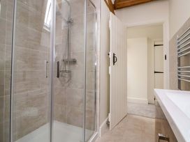 A bathroom with a shower and sink at Isfryn 