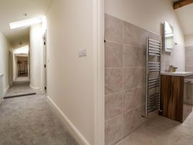 A bathroom with a towel rack and cabinet at Isfryn