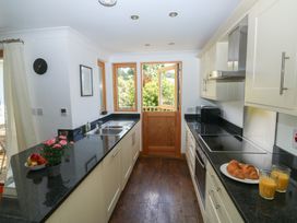 A kitchen with countertop and sink at 2 Court Cottage Dartmoor