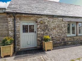 A front entrance with a door and planters at Roughtor Barn Poldue near Camelford
