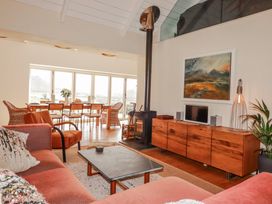 A living room with a sofa and coffee table at Roughtor Barn in Poldue near Camelford