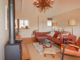 A living room with a sofa and coffee table at Roughtor Barn Poldue near Camelford