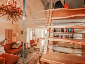 A living room with a sofa and coffee table at Roughtor Barn Poldue near Camelford