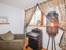 An office with an armchair and a desk at Roughtor Barn Poldue near Camelford