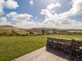 A scenic view of hills and water at Roughtor Barn Poldue near Camelford