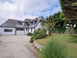 A house with a garden and pathway at Seaworthy in Daymer Bay