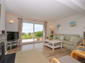 A living room with a sofa and coffee table at Seaworthy in Daymer Bay