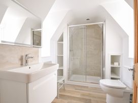 A bathroom with a sink and shower at Seaworthy in Daymer Bay