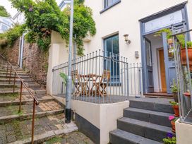 A small outdoor area with a table and chairs at 2 The Old School House