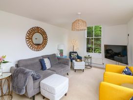 A living room with a sofa and television at 2 The Old School House
