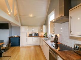 A kitchen with appliances and wooden countertop at 2 The Old School House