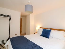 A bedroom with a bed and wardrobe at 2 The Old School House