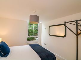 A bedroom with a bed and a window at 2 The Old School House