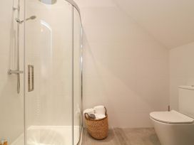 A bathroom with a shower and toilet at 2 The Old School House