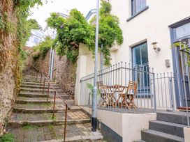 An outdoor area with stairs and a table with chairs at 2 The Old School House