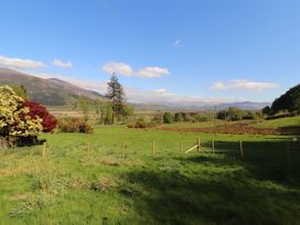 A scenic view of mountains and trees at Wren's Nest in Thornthwaite near Braithwaite