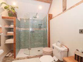 A bathroom with a shower and toilet at Garden Cottage in Saintbury near Broadway
