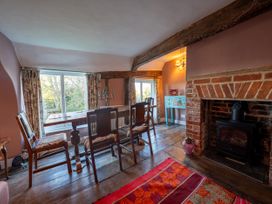 A dining room with a table and chairs at 5 St. Michaels Close in Framlingham