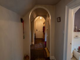 A hallway with a door and coat hooks at 5 St. Michaels Close Framlingham