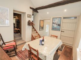 A dining room with a table and chairs at Old Cottage Oxen Park near Ulverston