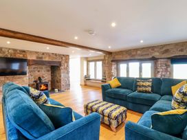 A living room with a sofa and television at Heathmoor in Horrabridge