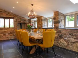 A dining room with a table and chairs at Heathmoor in Horrabridge