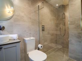 A bathroom with a shower, toilet and sink at Heathmoor in Horrabridge