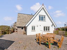 An outdoor area with a table and chairs at Capton Snug Capton near Dartmouth